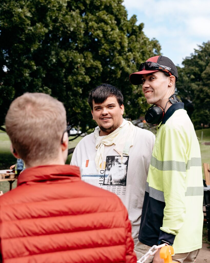 3 participants talking. Outside.