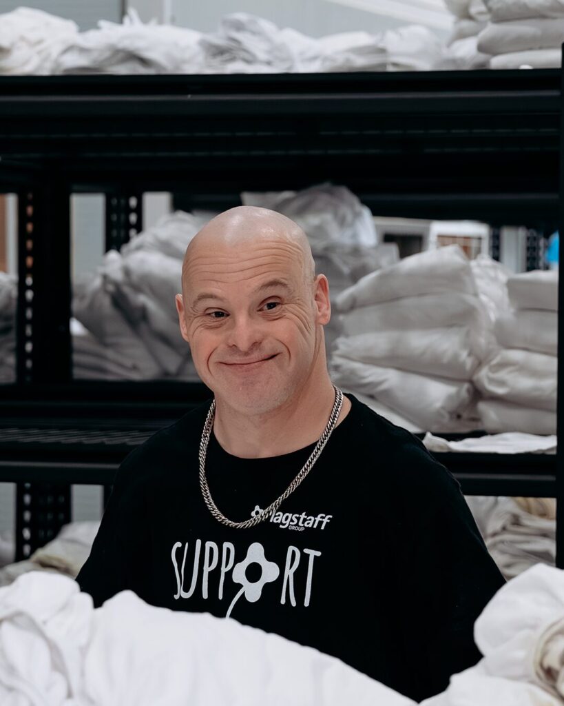 Scott smiling. Working in Flagstaff Laundry.