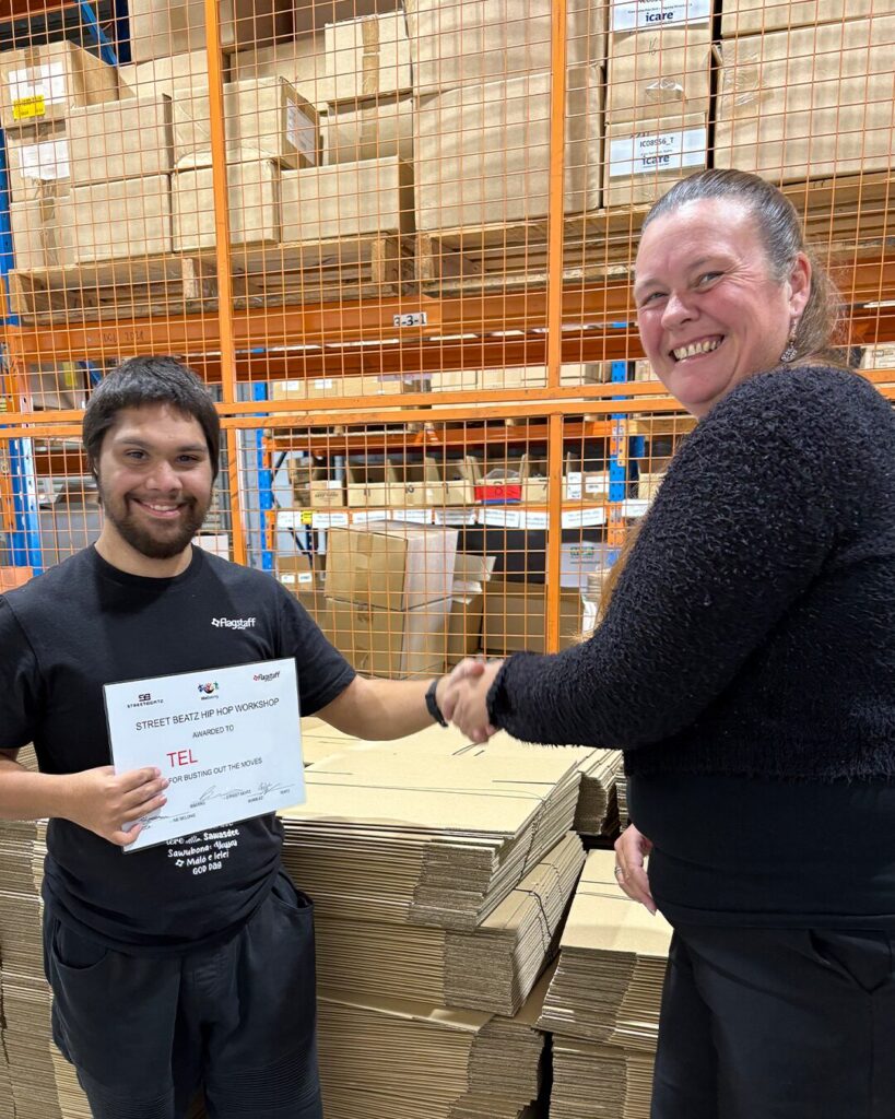 Tel receiving certificate for Street Beatz Hip Hop Dancing Workshop.